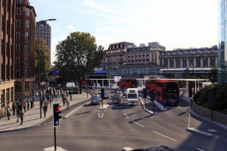 Street view of waterloo with buildings, buses and people communting
