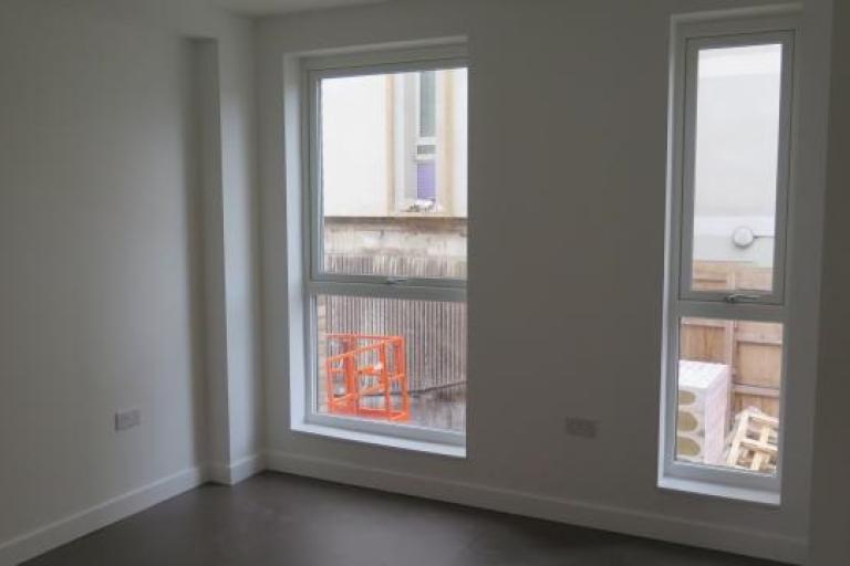 Inside newly constructed flat with a window view 