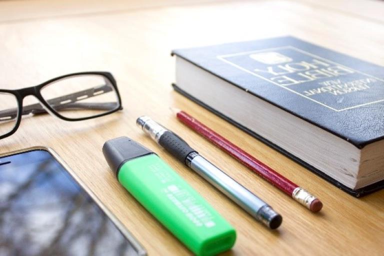 Pens and books on a table