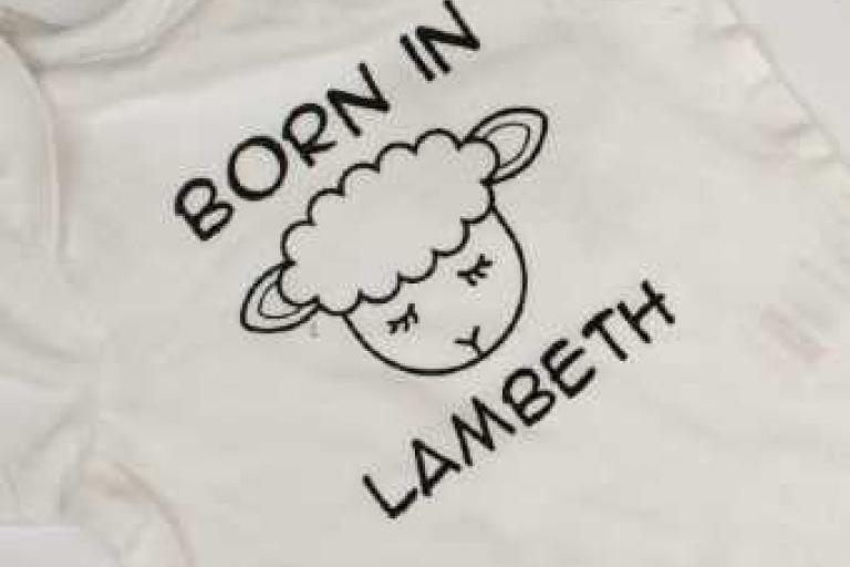 Born in Lambeth undated lamb bodysuit in white - close up