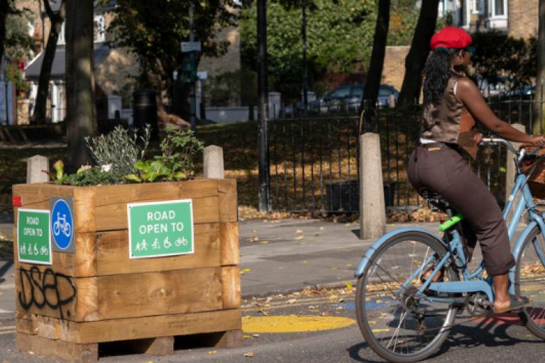 Lady cycling in lower traffic neighbourhood