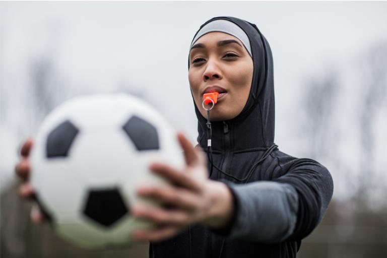 Woman holding a football