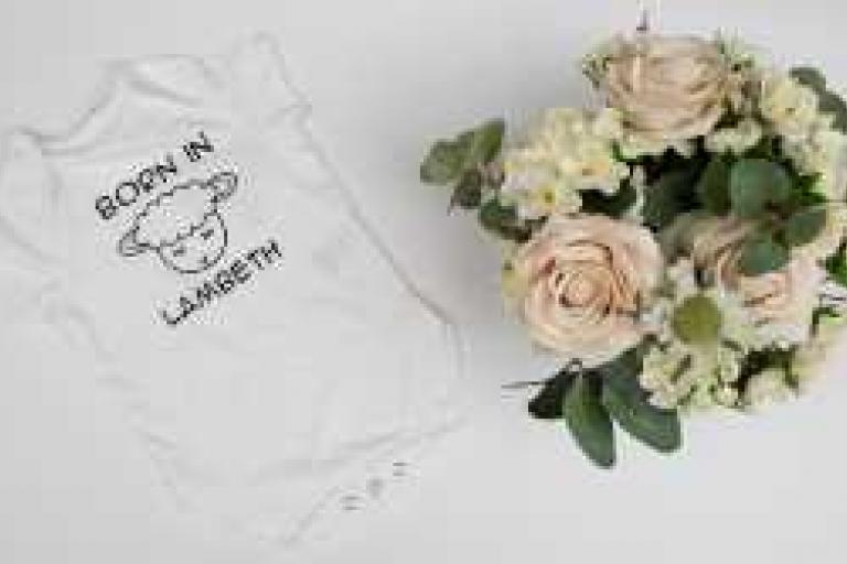 Born in Lambeth lamb bodysuit in white with flowers