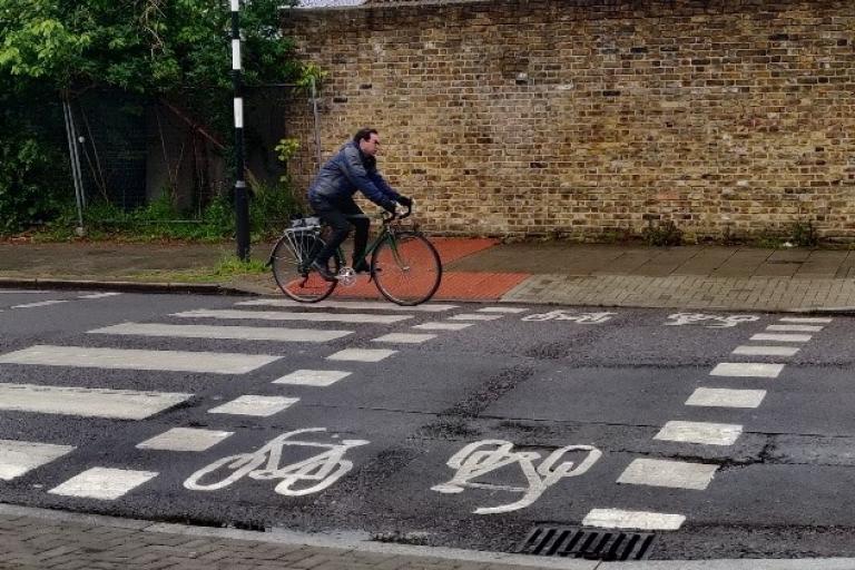Man cycles on parallel crossing