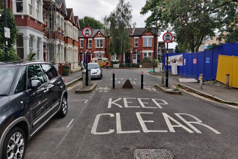 Image shows a modal filter, which allows cyclists and pedestrians to use a street but prevents drivers from passing through