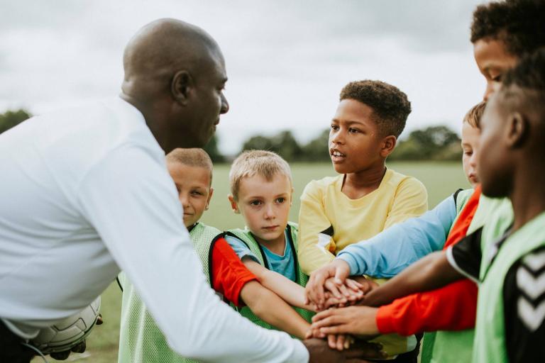 Junior football team on pitch