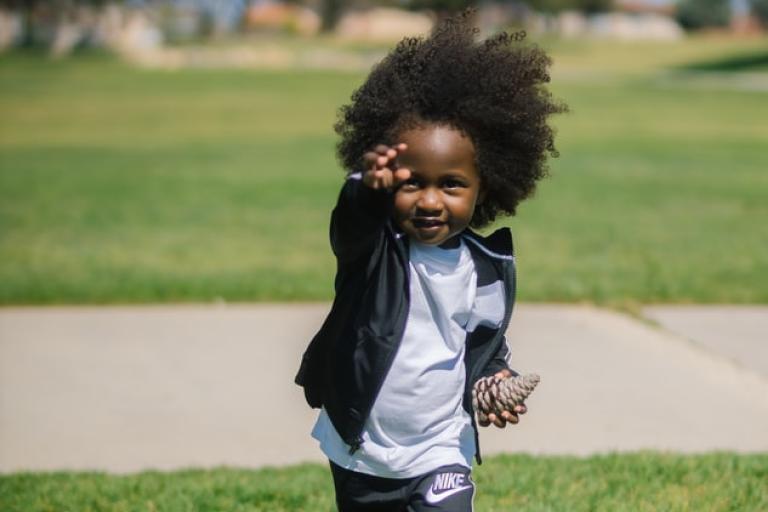 Boy outside on grass