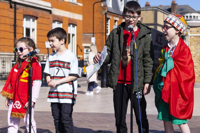 Children singing at outdoor event