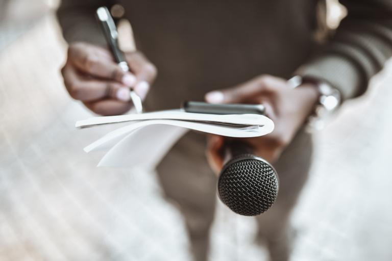 DJ musician producer holding microphone