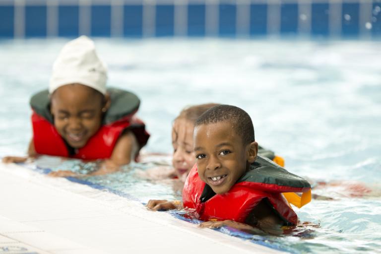 Children having a swimming lesson