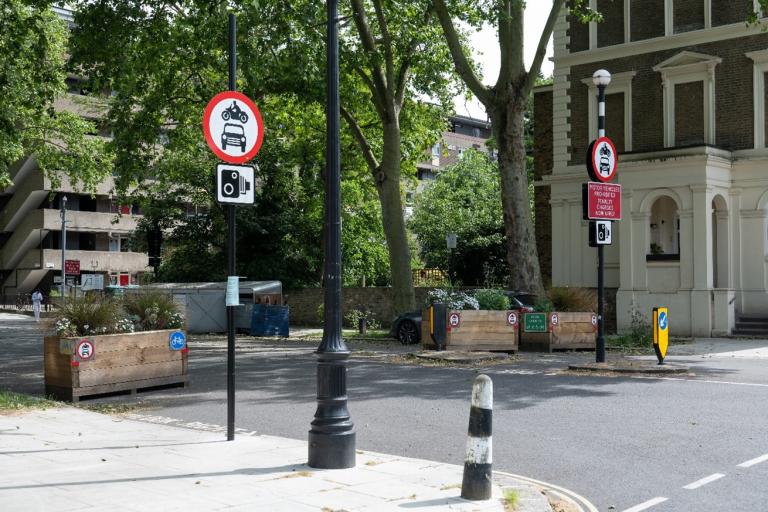 Two flower boxes filtering the width of the road. This is a trial traffic filter based in Oval LTN.