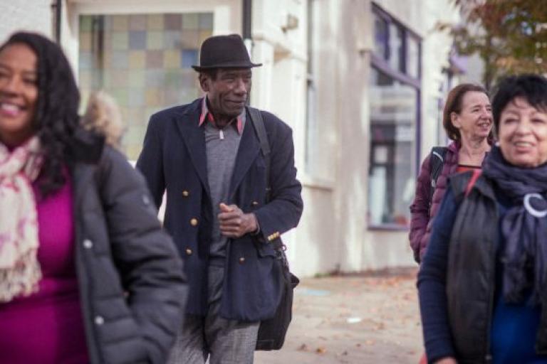 Older people walking down a street