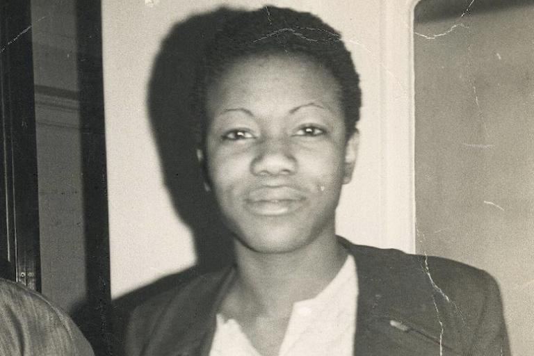 black and white photo of a woman staring into the camera