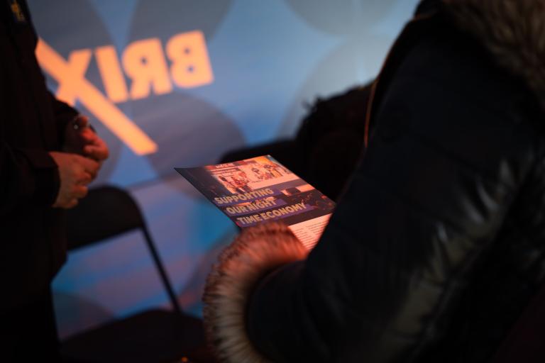 Person with a flyer in hand