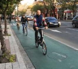 Male cycling on cycle track lane