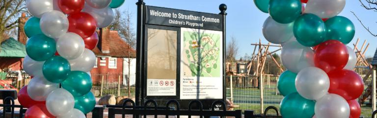 Entrance to Streatham Common children's playground grand opening with balloon arch
