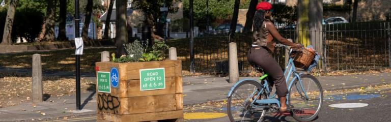 Lady cycling in lower traffic neighbourhood