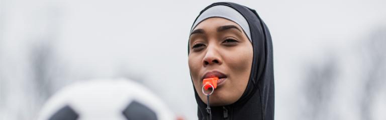 Woman holding a football