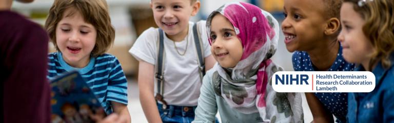 Five children listening to a story read by an adult