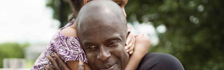 child embracing an adult