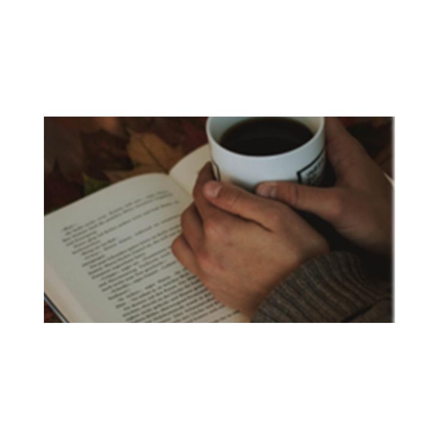 Coffee cup on a book