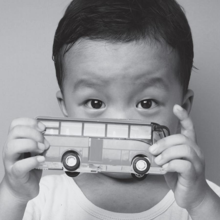 SEND local offer a child holding a toy bus