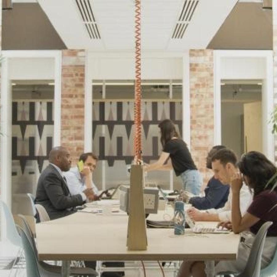 People working at desks in the Tripod workspace 