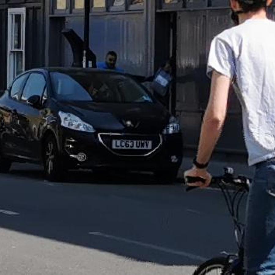 Member of public cycling through Railton area