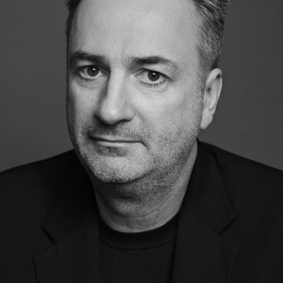 Paul sitting and staring at the camera