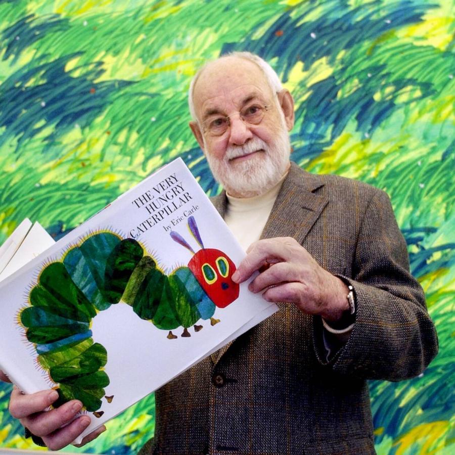 Eric Carle shows of his book