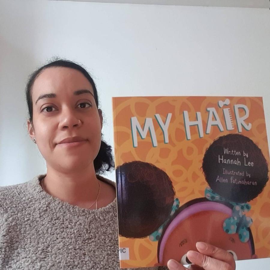 Tamika displaying my hair book