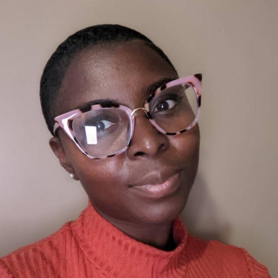 Akitoye poses on camera
