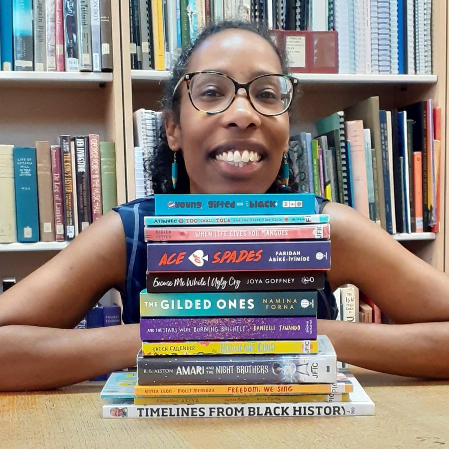 Zoey surrounded by books
