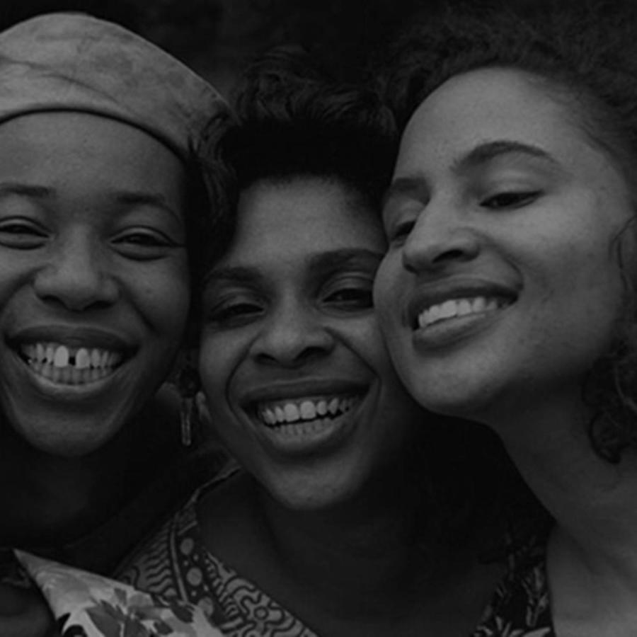 Snapshot of three women posing for the camera