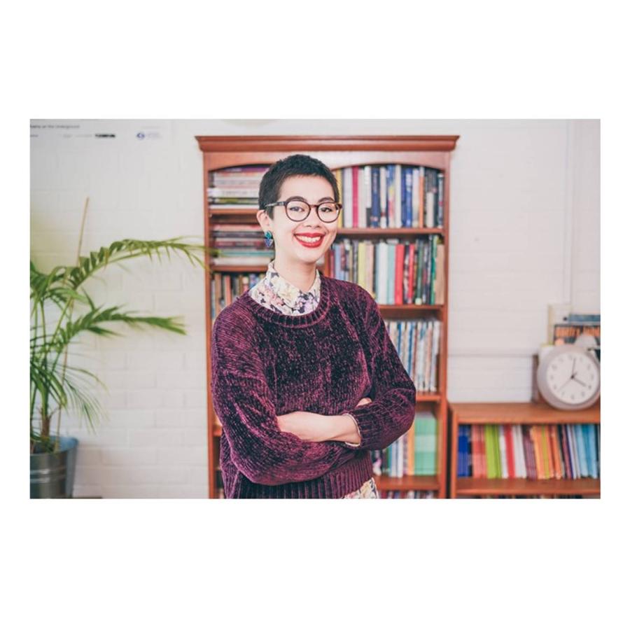 Helen Bowell standing infront of a book display