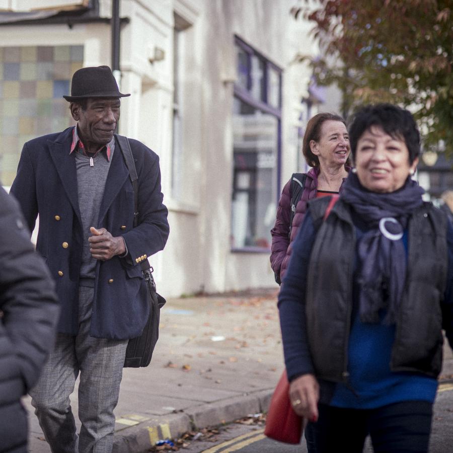 Group of older people walking to event