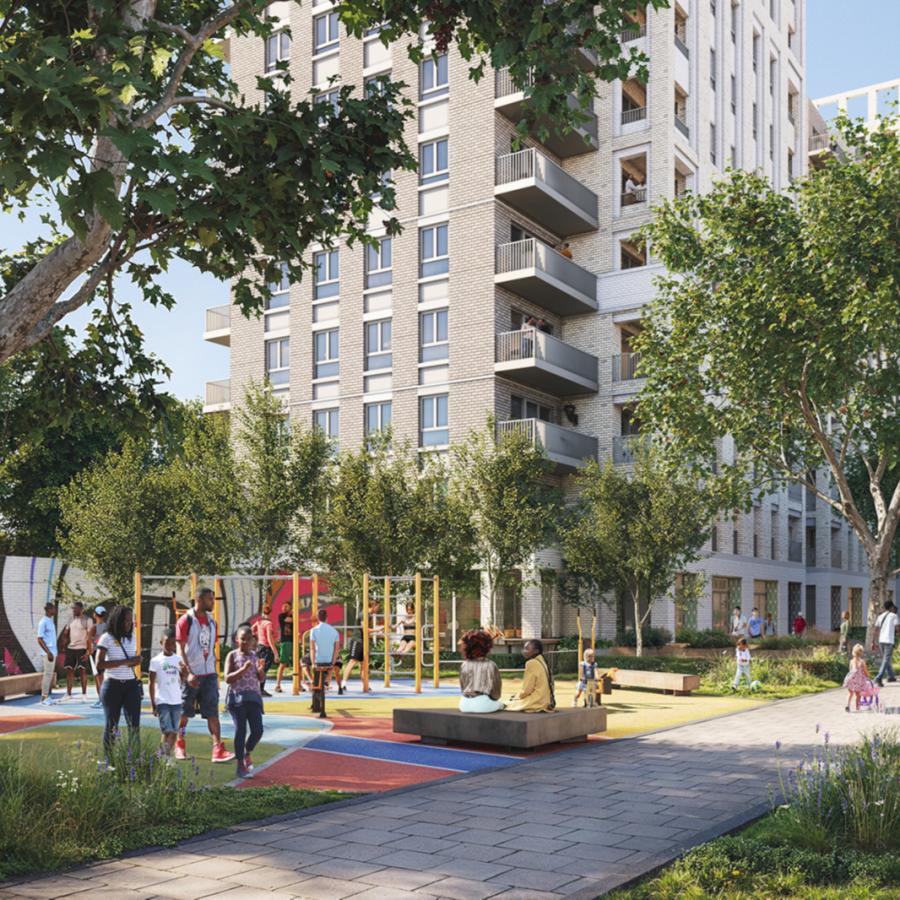 Road leading to the new build Somerleyton Estate with children playing in the playground in front.