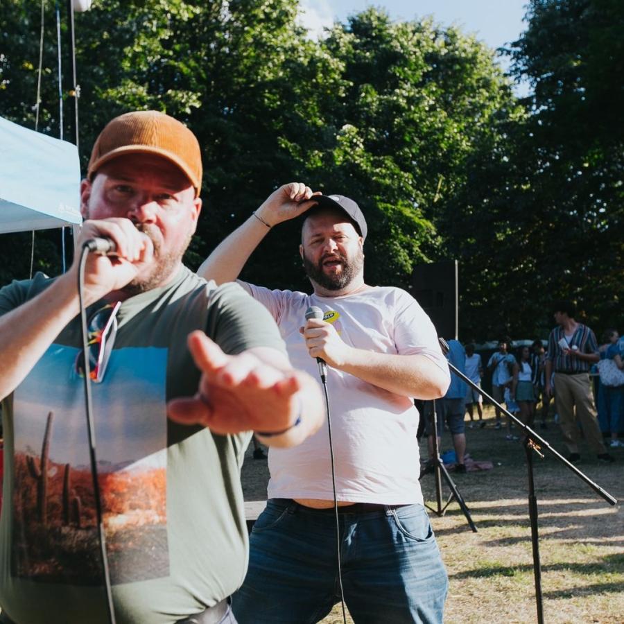 bearpit karaoke 2 men in caps singing