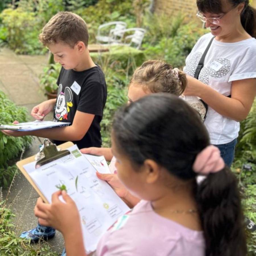 family investigating edible plants