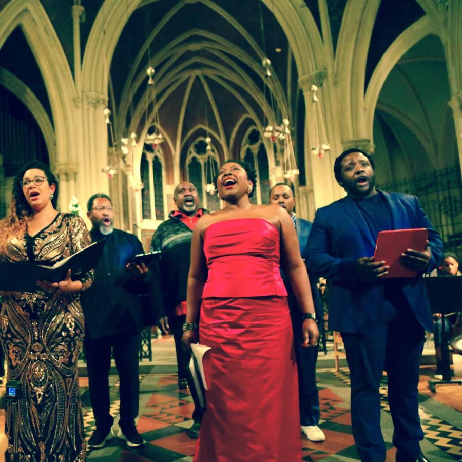 A group of people performing in an orchestra