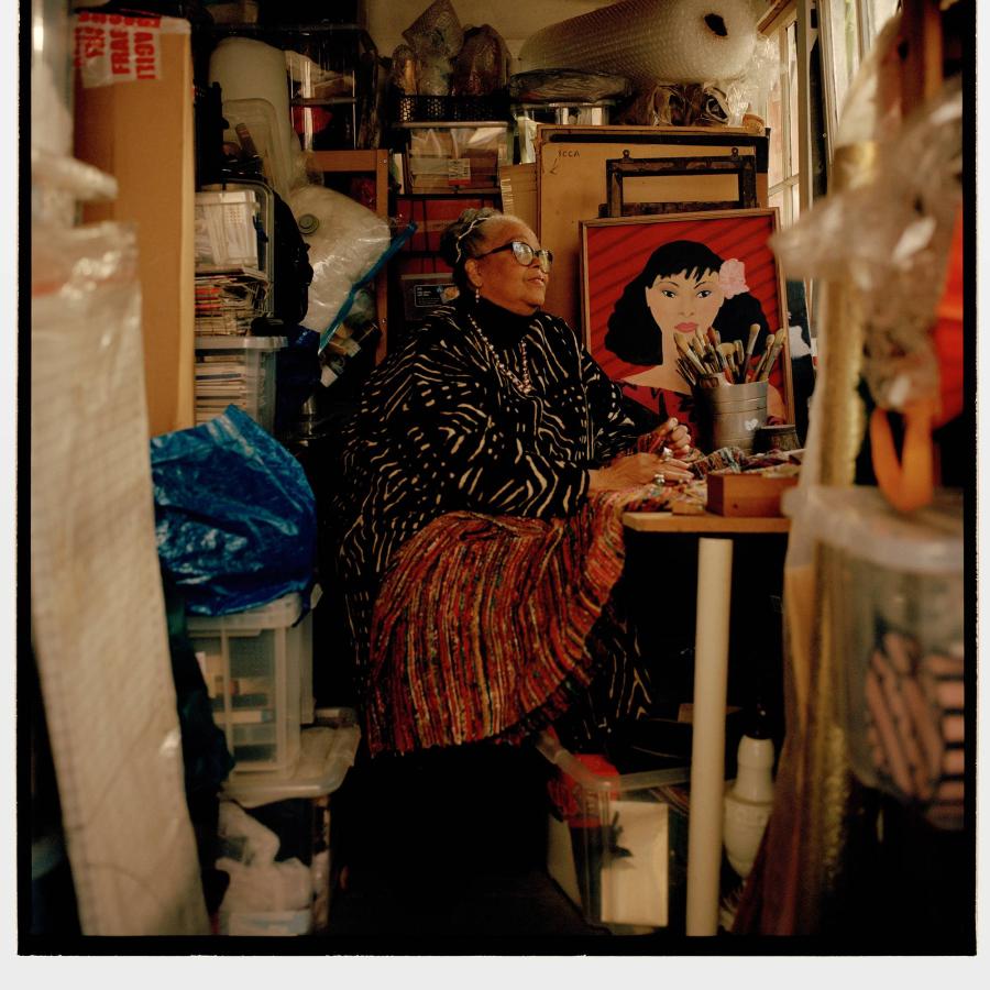 A photo of Rita Keegan starring at a portrait