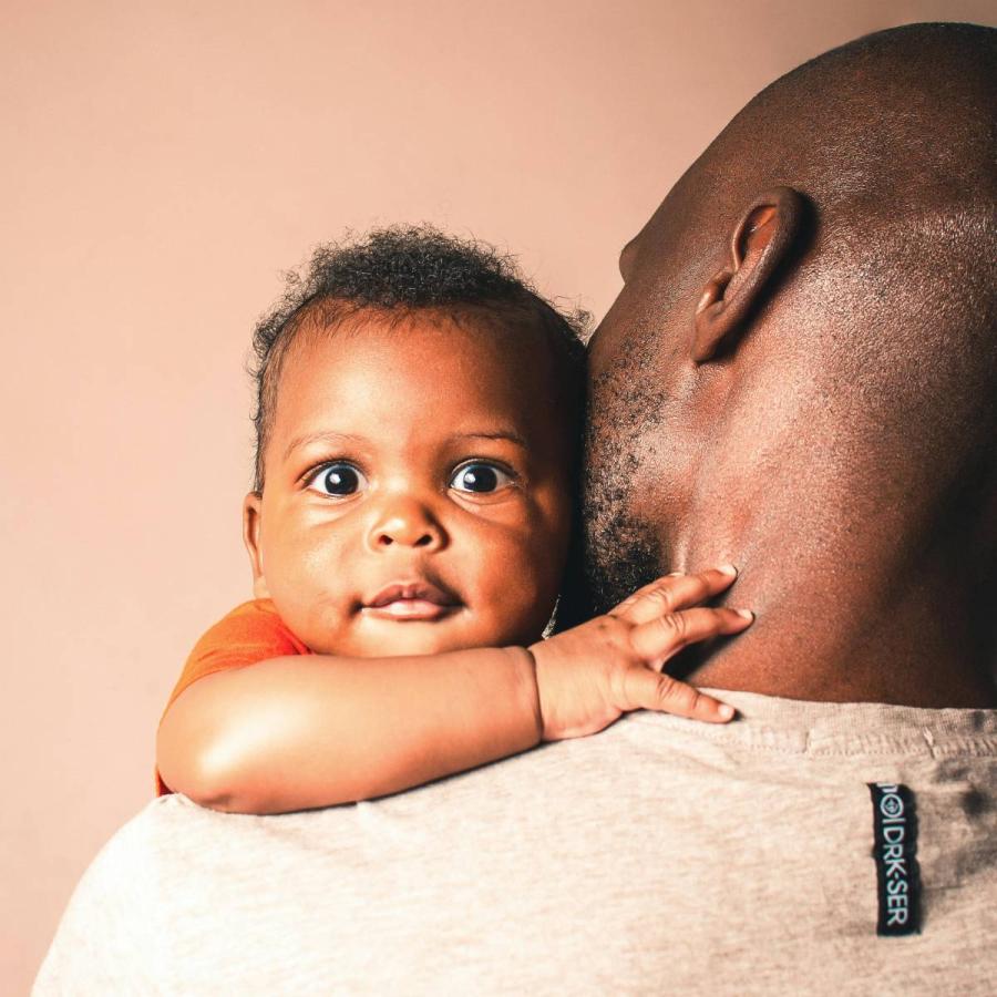 a man carrying a child