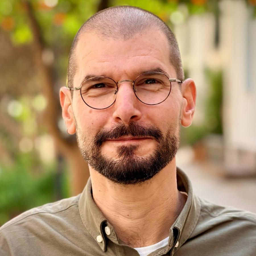 A photo of Lambros smiling