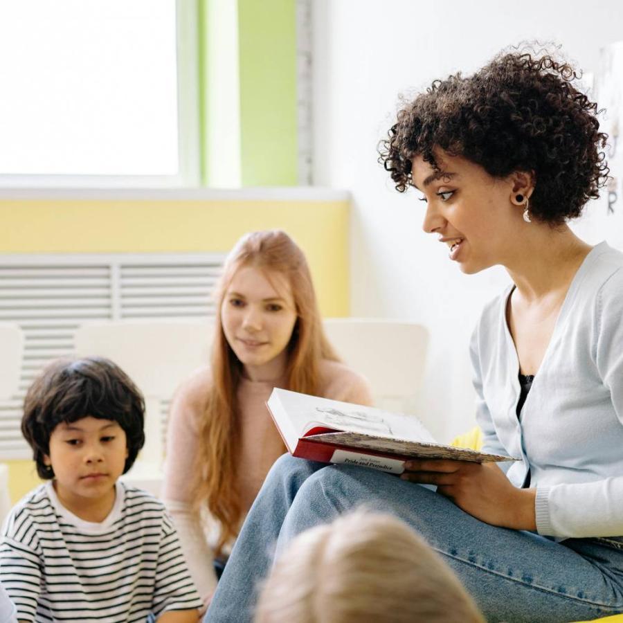 Teacher reading to a group of children