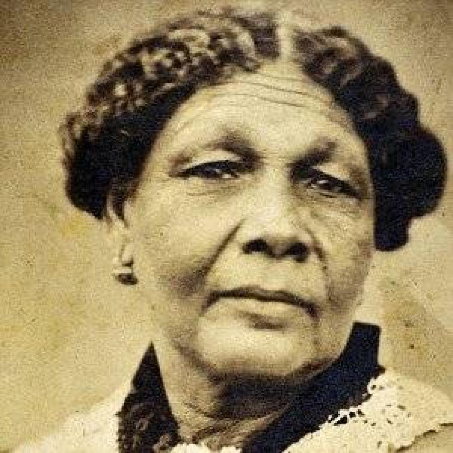 Vintage sepia portrait, formal attire, lace collar, historical photograph.